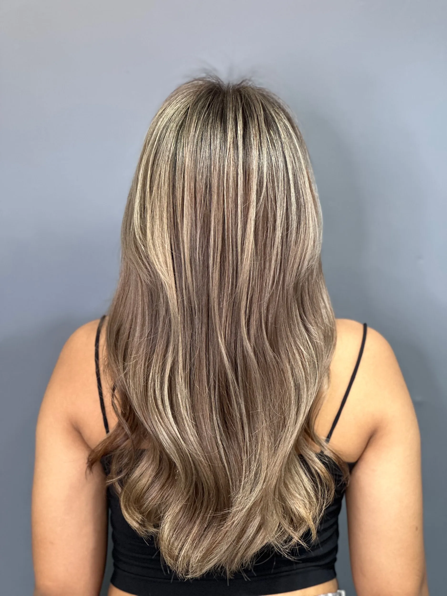Foil highlights being applied in a professional salon setting